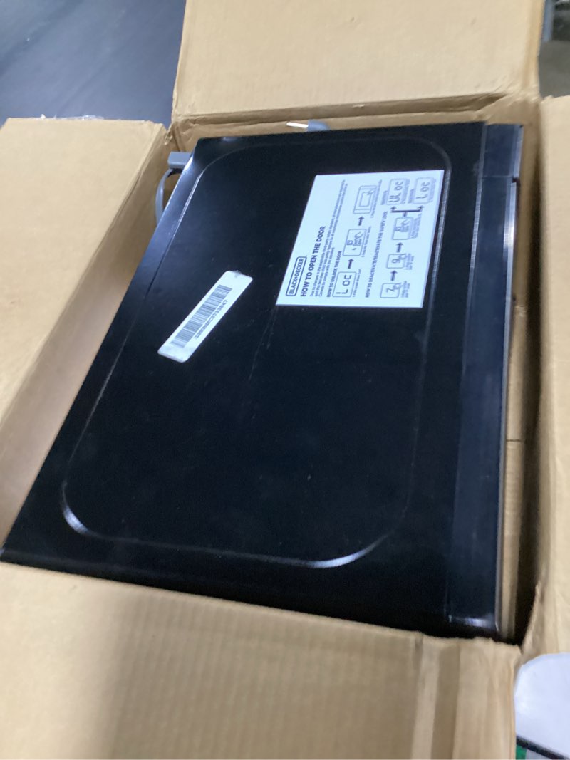 Condition photo showing As Is for BLACK+DECKER EM720CB7 Digital Microwave Oven with Turntable Push-Button Door, Child Safety Lock, 700W, Stainless Steel, 0.7 Cu.ft 0.7 cu. ft.