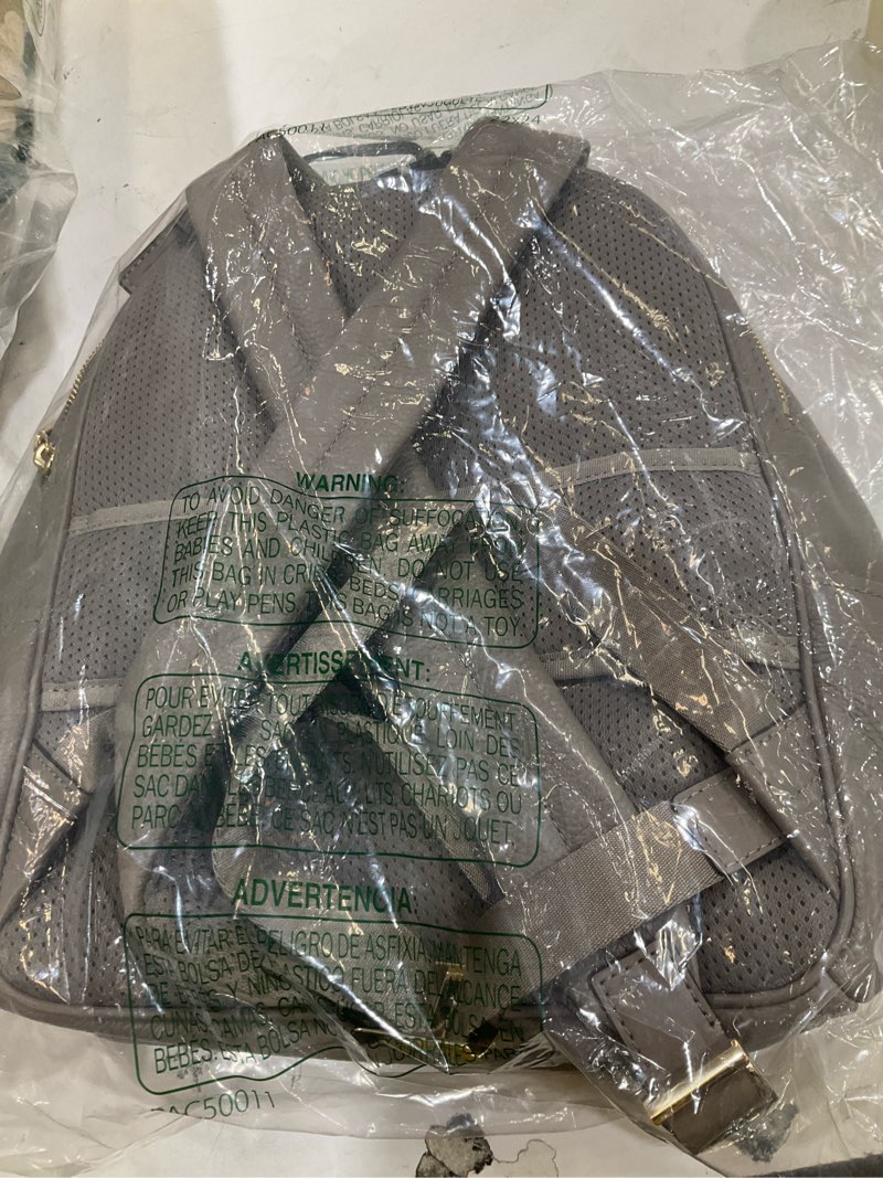 Condition photo showing New/Like New for michael kors pack back