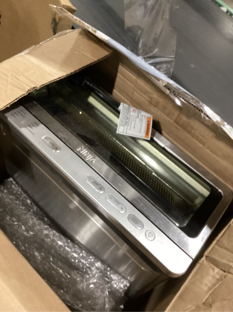 Condition photo showing As Is for Ninja Air Fryer Toaster Oven Combo | 8-in-1 Functionality | Flip Up & Away for Storage Space | Air Fry Basket, Sheet Pan, Wire Rack & Removable Crumb Tray |1800 Watt | Stainless Steel | SP151 Stainless Premium 8-in-1 Flip Oven