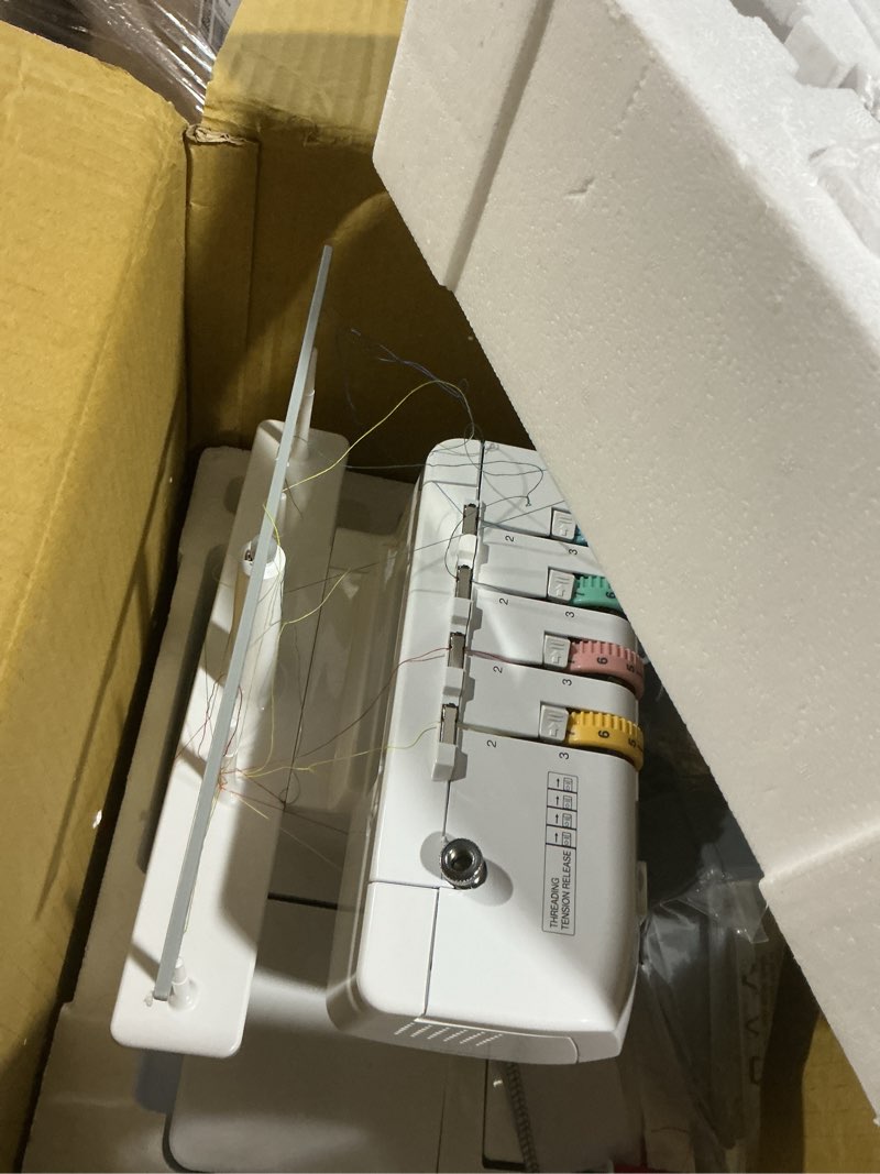 Condition photo showing As Is for brother serger, 1034d, heavy-duty metal frame overlock machine, 1,300 stitches per minute, removeable trim trap, 3 included accessory feet, white