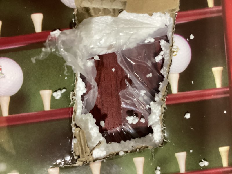 Condition photo showing As Is for the clubhouse collection executive golf ball display cabinet is a mahogany-stained wood case designed to hold 63 balls with a green felt background