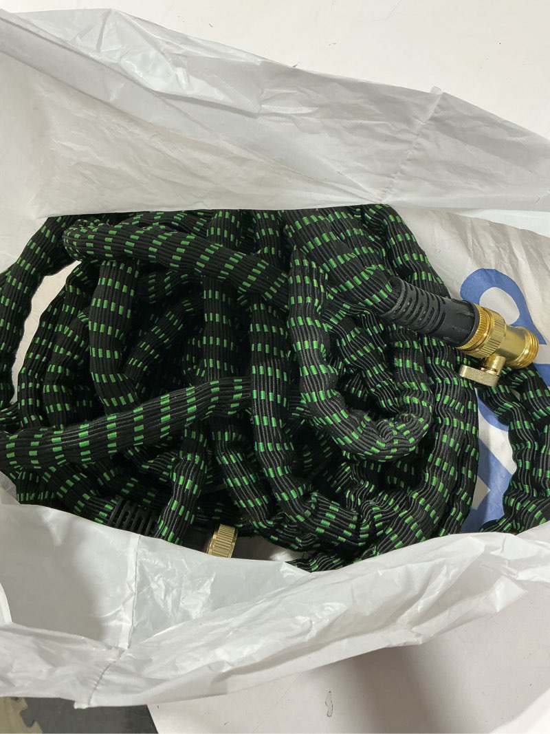 Condition photo showing As Is for flexi hose with 8 function nozzle, 50ft - lightweight expandable garden hose, no-kink flexibility, 3/4 inch solid brass fittings and double latex core - black and green green 50ft