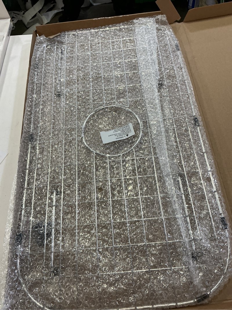 Condition photo showing New/Like New for sink protector grid 26-1/16" x 14-1/16", centered drain with corner radius 3-1/2", 304 stainless steel material centered drain 26-1/16" x 14-1/16" centered drain