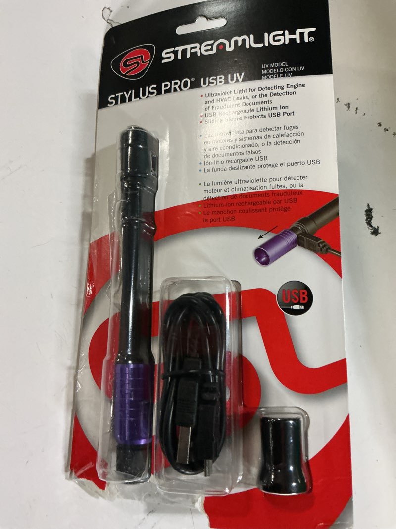 Condition photo showing New/Like New for streamlight 66148 stylus pro usb 400nm uv rechargeable penlight with 120v ac adapter, usb cord and nylon holster, black black usb rechargeable penlight penlight