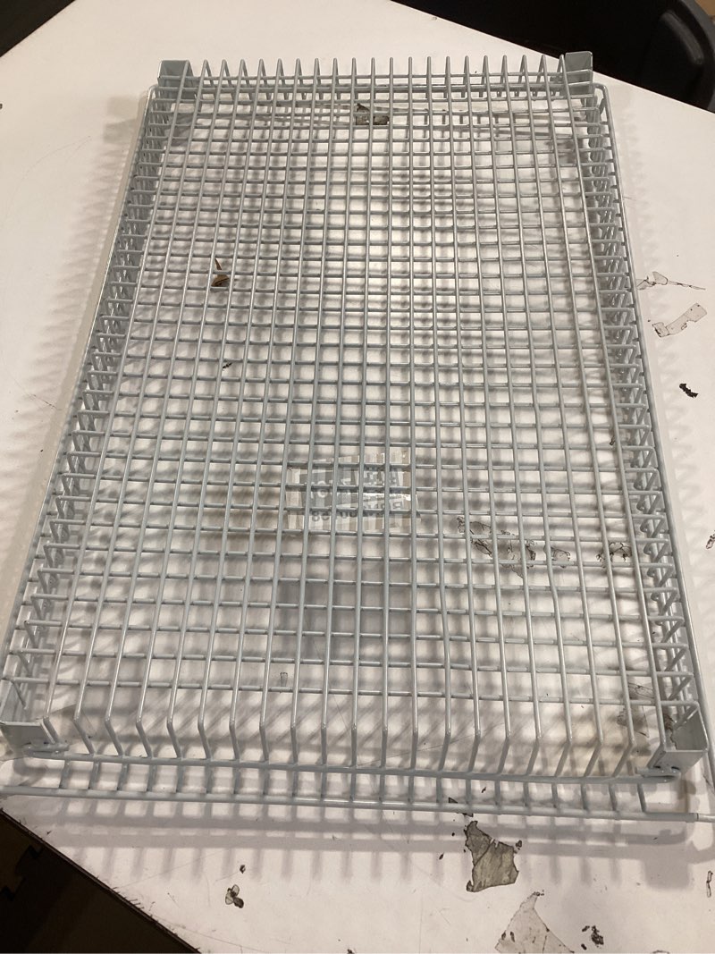 stainless steel wire basket, commonly used in commercial kitchens or specialized ovens for cooking, frying, or draining ingredients. 