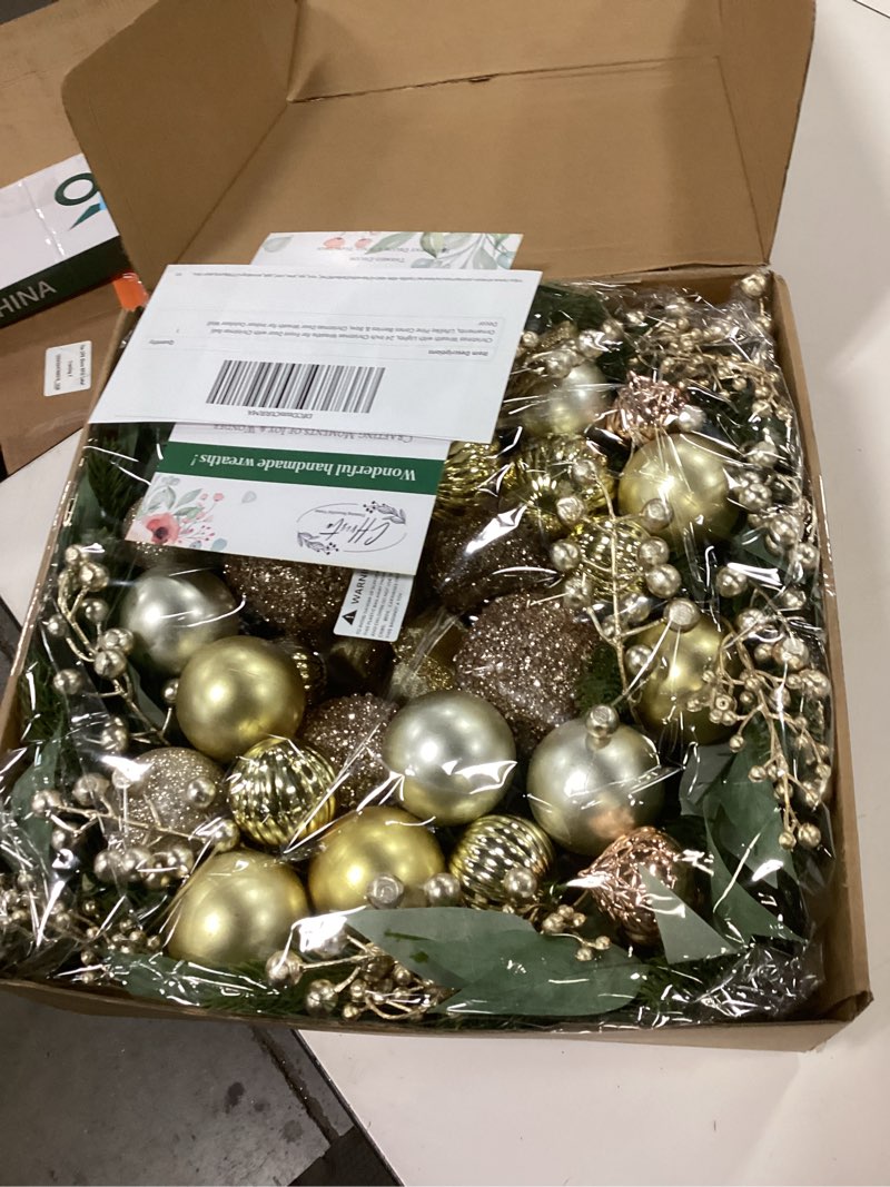 Condition photo showing Good Condition for Christmas Wreath with Lights, 24 Inch Christmas Wreaths for Front Door with Christmas Ball Ornaments, Lifelike Pine Cones Berries & Bow, Christmas Door Wreath for Indoor Outdoor Wall Decor