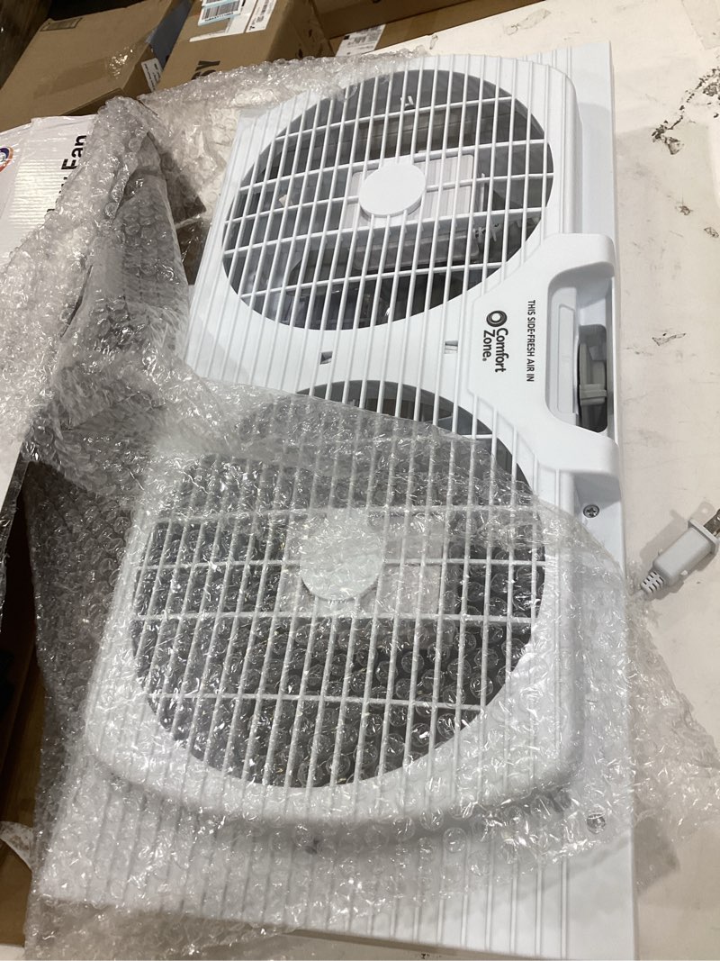 Condition photo showing Good Condition for comfort zone twin window fan with reversible airflow control, 9 inch, auto-locking expanders, 2 speed fan, dual fan, exhaust, airflow 9.84 ft/sec, ideal for home, kitchen, bedroom & office, cz319wt white 9"