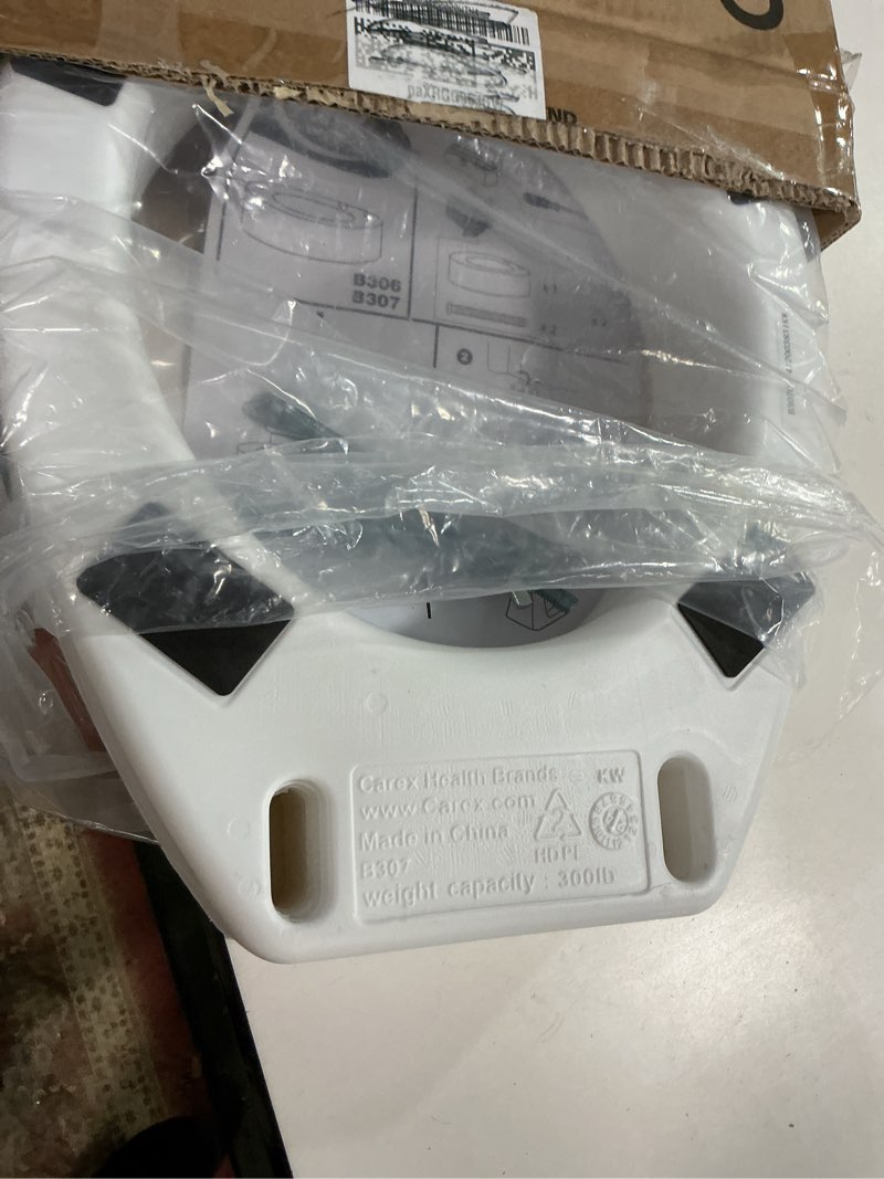 Condition photo showing As Is for Carex Toilet Seat Riser, Round Raised Toilet Seat Adds 3.5 inches to Toilet Height, for Assistance B