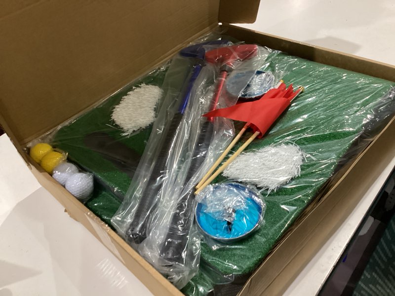 Condition photo showing New/Like New for golf putting game set, golf putting green mat with 4 balls, 2 cups & flags, 1 portable bag for outdoor & indoor party game putter