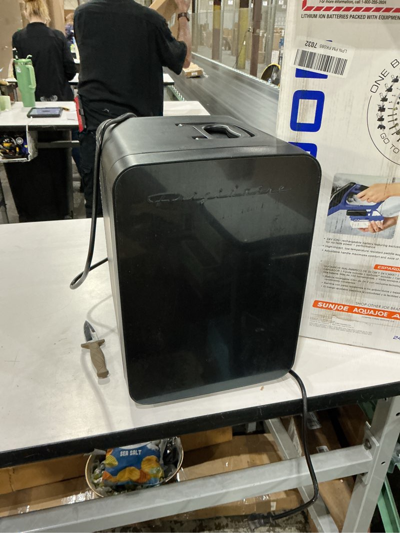 Condition photo showing As Is for Frigidaire Mini Personal Fridge Cooler, Countertop, Holds Up to 10L/15 Cans, Brushed Black Stainless Rugged Design, Portable for Skincare, Makeup, Car, Office, Bedroom, Dorm Room, or Cabin