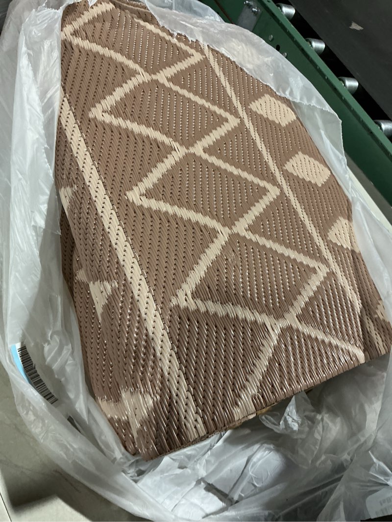 Condition photo showing As Is for (unknown measurement) nourison positano indoor/outdoor jute area rug patio