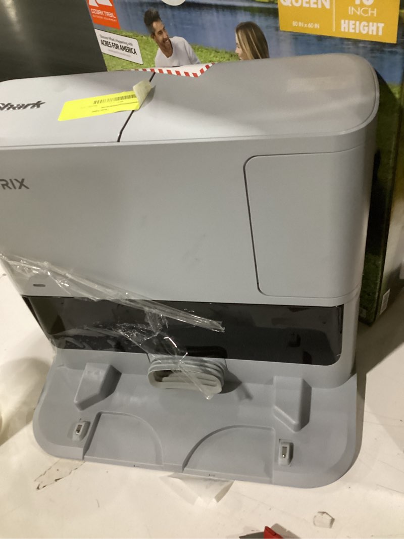 Condition photo showing As Is for shark matrix self-emptying robot vacuum base only