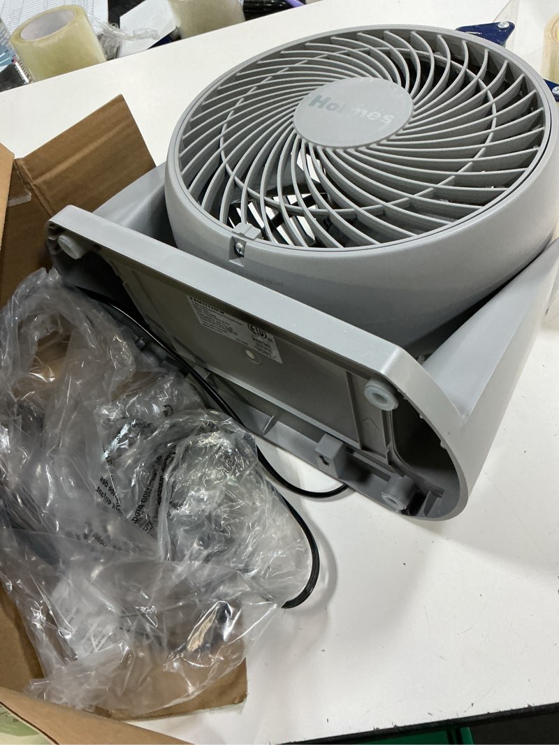 Condition photo showing As Is for holmes blizzard air circulator fan, 3 speeds, 90° tilt, removable grill, cool grey