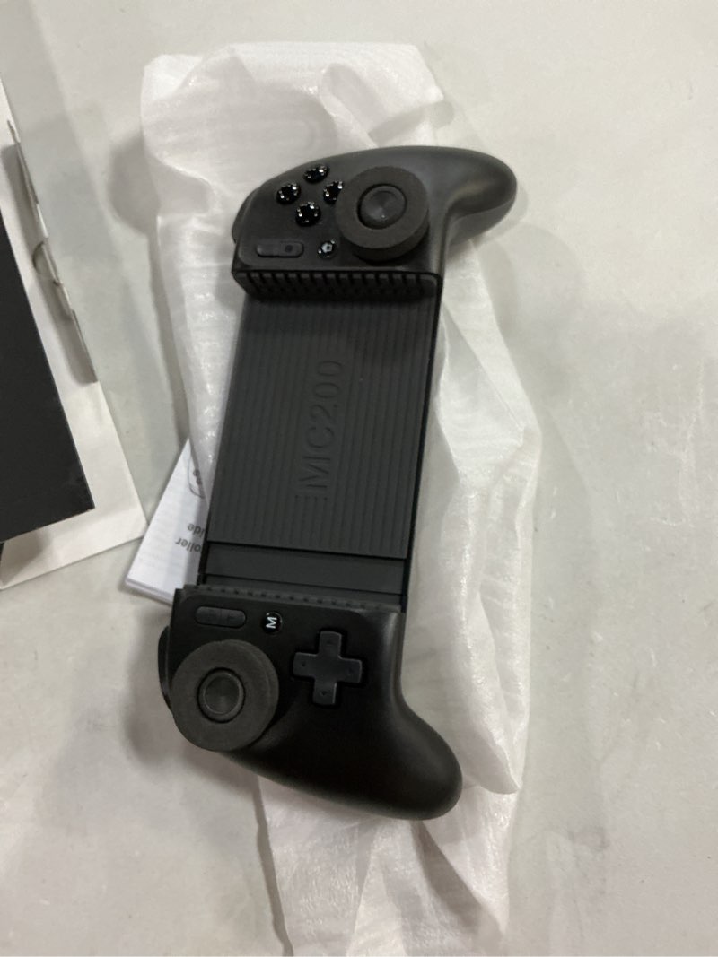 Condition photo showing Good Condition for mocagen phone game controllers for iphone/android, marco buttons, analog triggers, no drift joysticks & thumb grips, turbo, vibration black