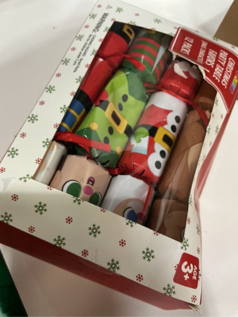 Condition photo showing Good Condition for JOYIN 12 Pack Christmas No-Snap Party Favor, Xmas Table Favor Includes Party Hat, Jokes & Gifts, Christmas Table Decorations for Holiday Dinner Traditions Party Supplies, Stocking Stuffers for Kids