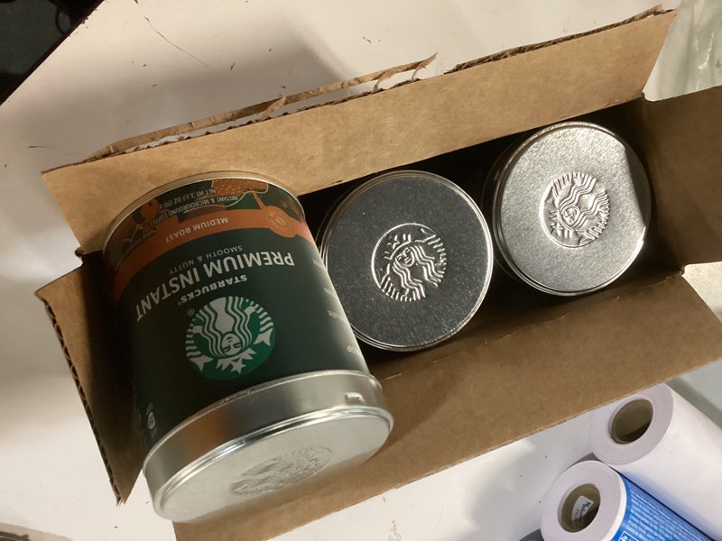 Condition photo showing New/Like New for starbucks premium instant coffee, medium roast coffee, arabica beans, three 3.17 oz tins