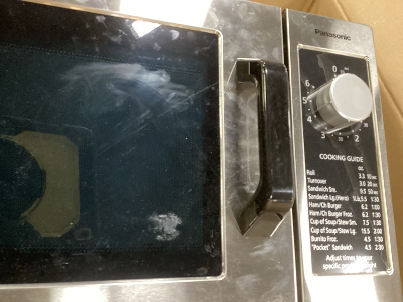 Condition photo showing As Is for Panasonic NE-1025F Compact Light-Duty Commercial Microwave Countertop Oven with 6-Minute Electronic Dial Control Timer, Bottom Energy Feed, 1000W, 0.8 Cu. Ft. Capacity Silver