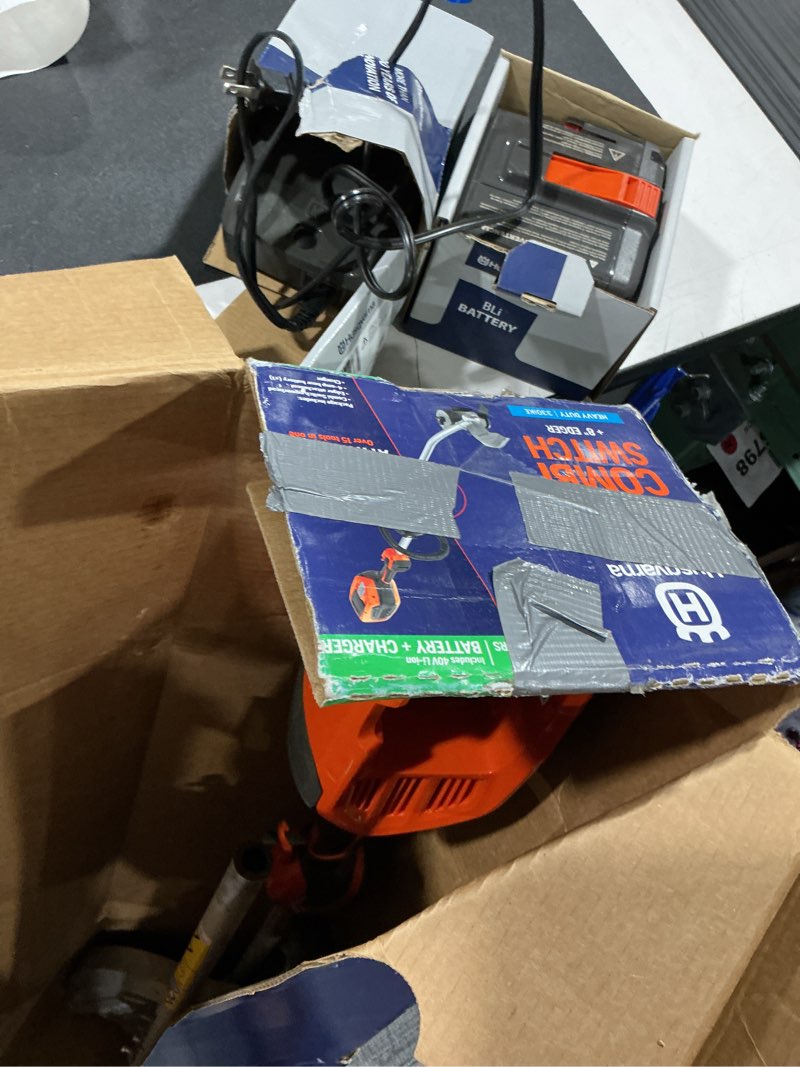 Condition photo showing As Is for husqvarna 330ike combi switch + lawn edger attachment, electric edger with battery and charger included, 970701202
