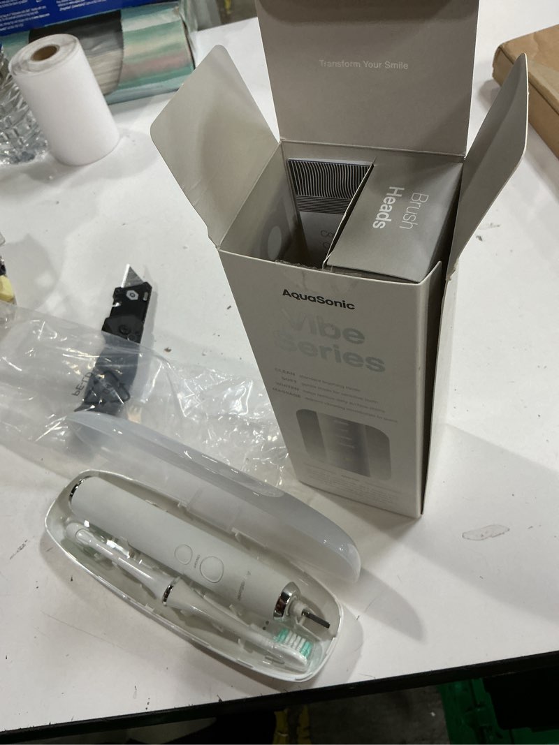 Condition photo showing New/Like New for aquasonic vibe series ultra-whitening toothbrush – ada accepted electric toothbrush - 8 brush heads & travel case – 40,000 vpm motor & wireless charging - 4 modes w smart timer – optic white
