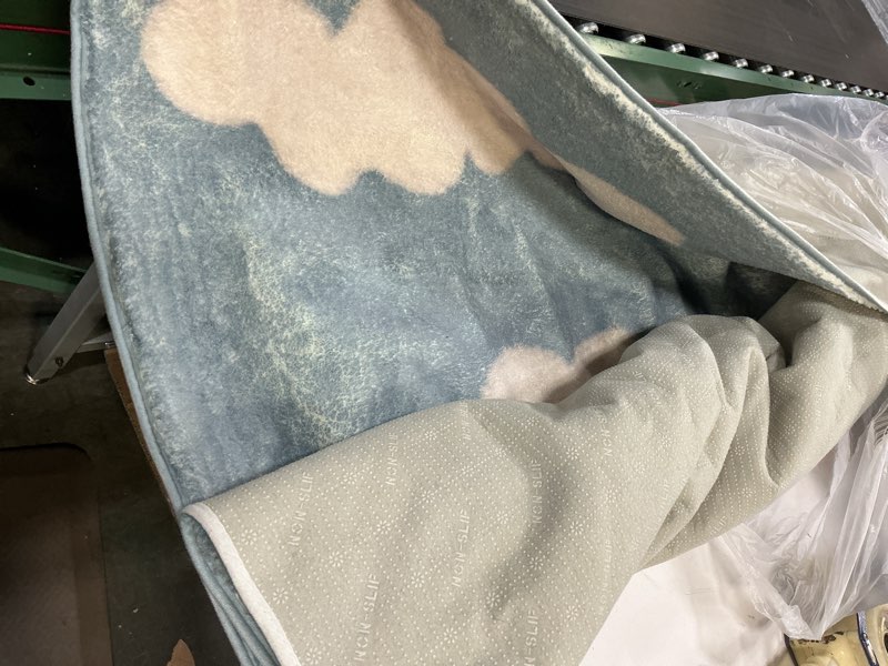 Condition photo showing As Is for ustide 4 x6 blue sky white cloud area rug super soft fluffy kids rug machine washable non slip carpet floor mat for bedroom living room nursery girls boys room decor blue 4'x6'