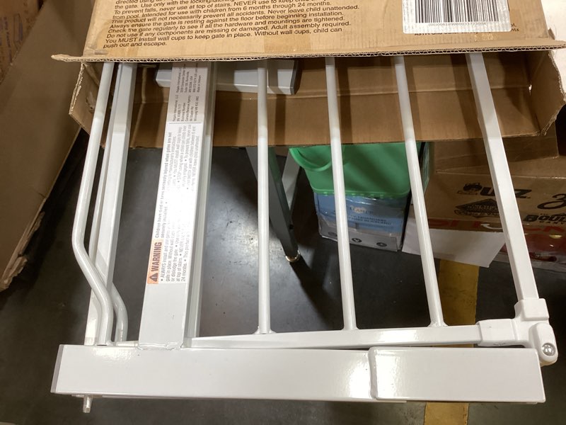 Condition photo showing As Is for regalo safety 29-38.5" baby gate for doorways & bottom of stairs, pressure mounted baby gate with door for babies, toddlers & pets, tested & safe for 30 years, american designed, american owned, white white 29-38.5"w x 30"h