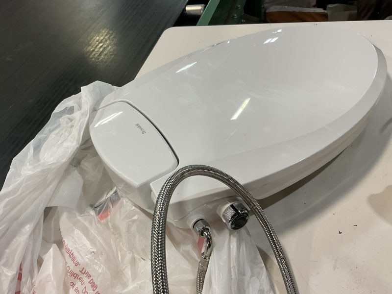 Condition photo showing As Is for brondell ecoseat plastic white elongated slow close feature bidet function toilet seat