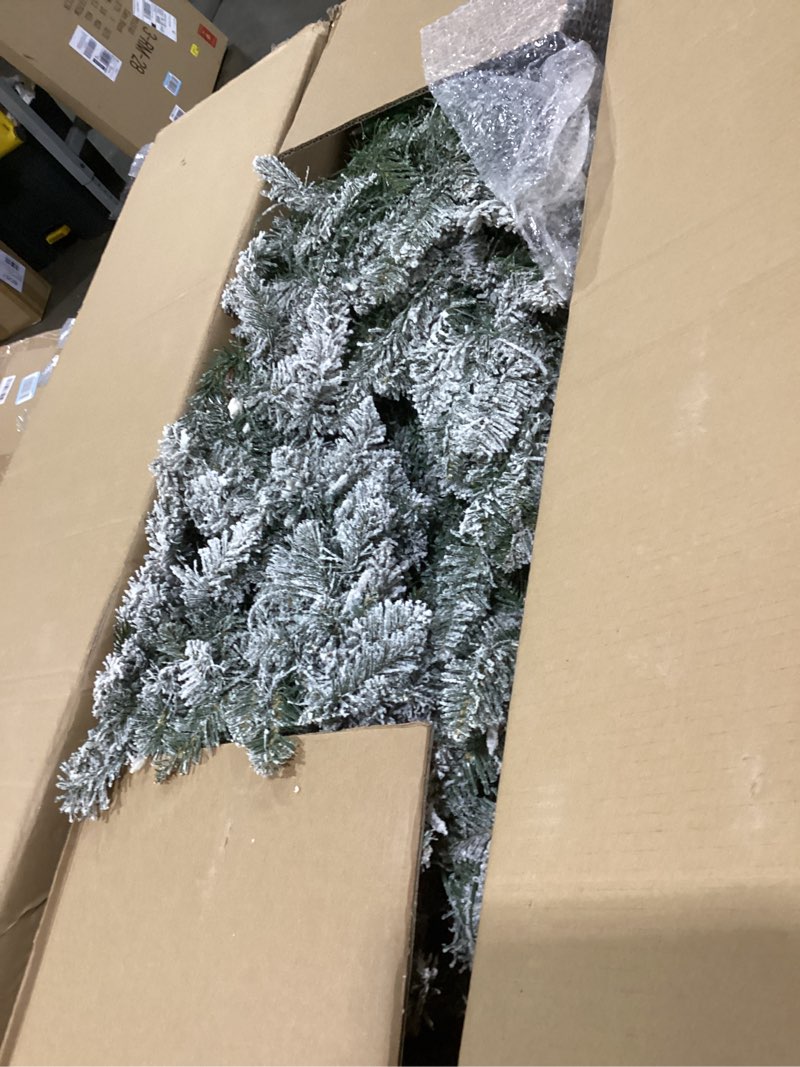 Condition photo showing Good Condition for Puleo International 7.5 Foot Pre-Lit Slim Flocked Fraser Fir Artificial Christmas Tree with 500 UL Listed Clear Lights 7.5' Slim Flocked Fraser Fir with 500 Clear Lights Christmas Tree