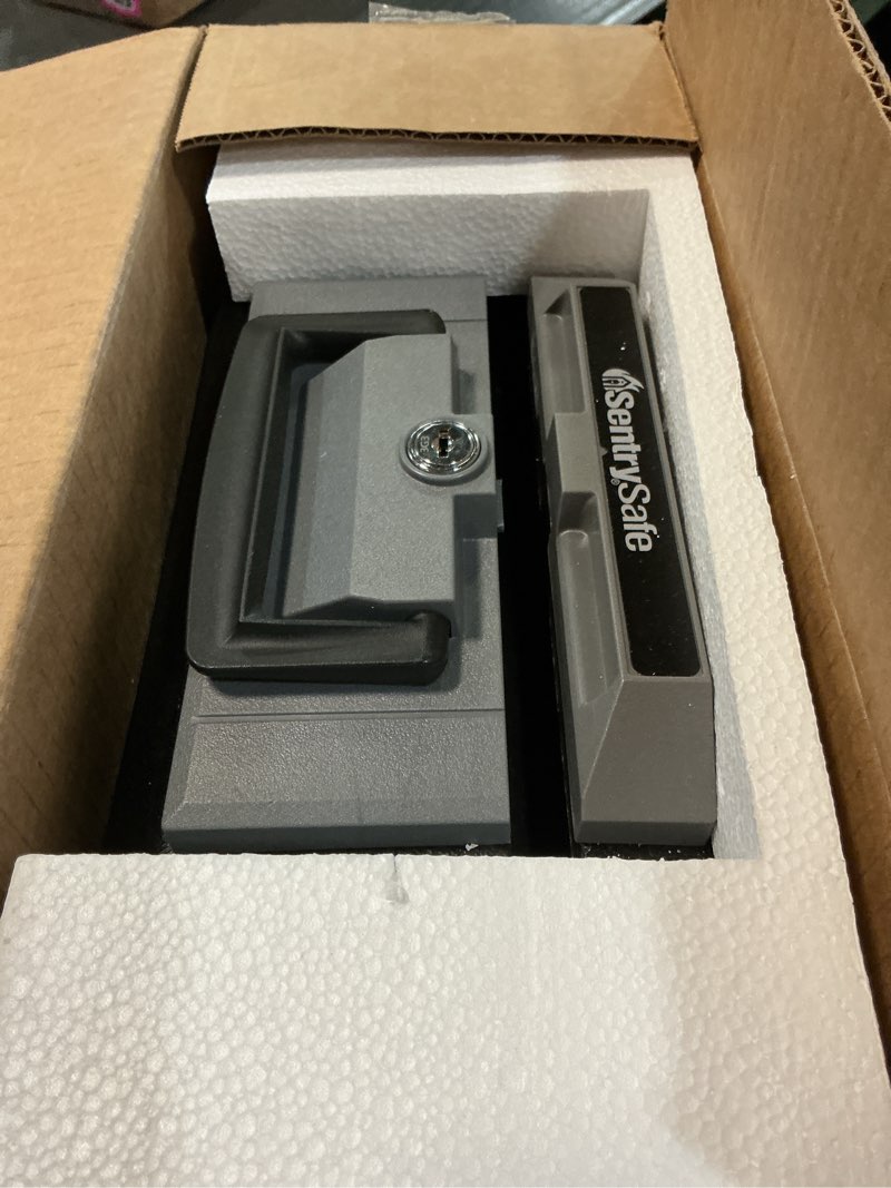Condition photo showing As Is for sentrysafe fireproof safe box with key lock, chest safe with carrying handle to secure money, jewelry, documents, 0.25 cubic feet, 6.3 x 15.3 x 12.1 inches, 1160 fire resistant box 0.25 cu. ft.
