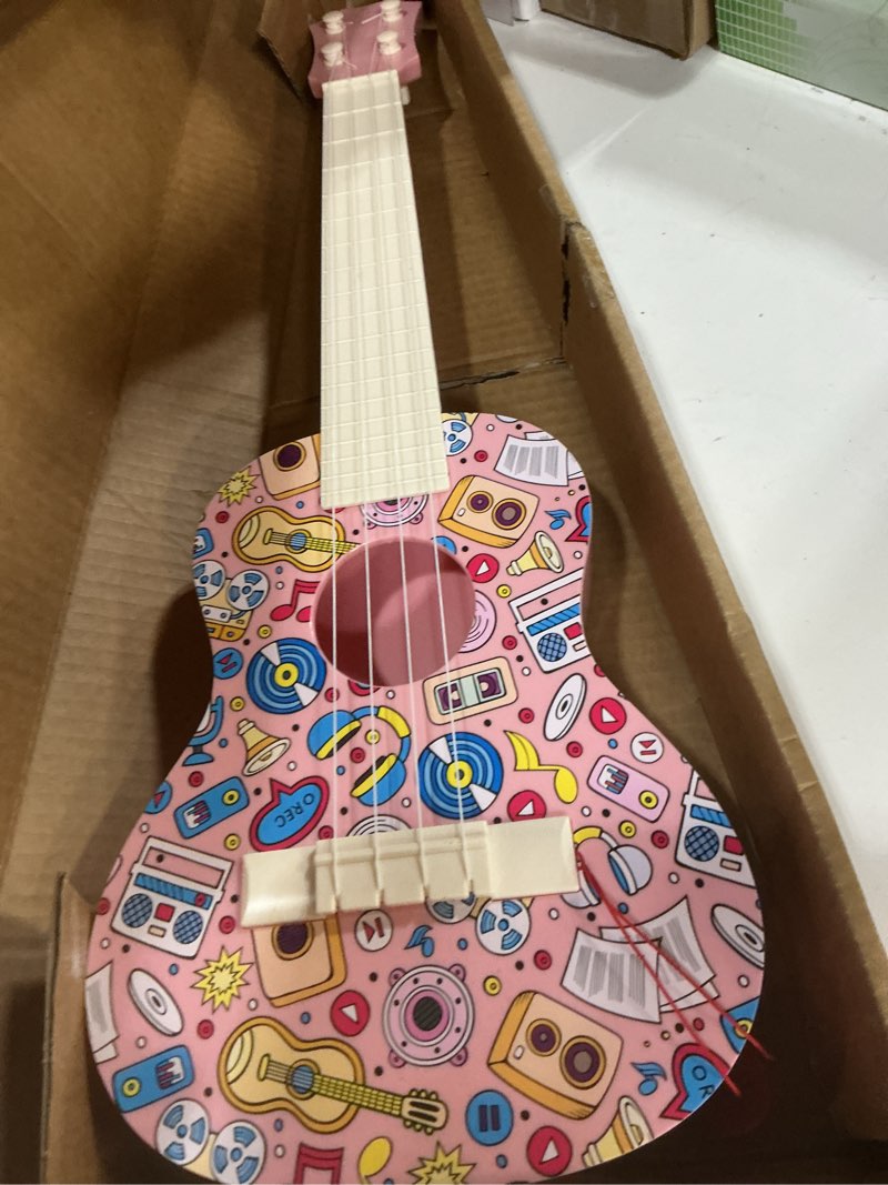 Condition photo showing Good Condition for LeeQee 21in Colorful Graffiti Ukulele Guitar for Kids, 4 Strings Kids Guitar Ukulele Musical Instruments Learning Educational Toys with Picks for 3 4 5 6 7 8 9 10 11 12 Toddler Boys Girls (Pink)