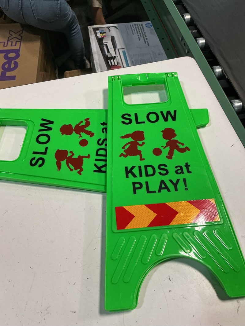 Condition photo showing New/Like New for slow kids at play sign, children at play safety signs with double-sided text and graphics with reflective tape for street neighborhoods schools park sidewalk driveway green 2pack green medium