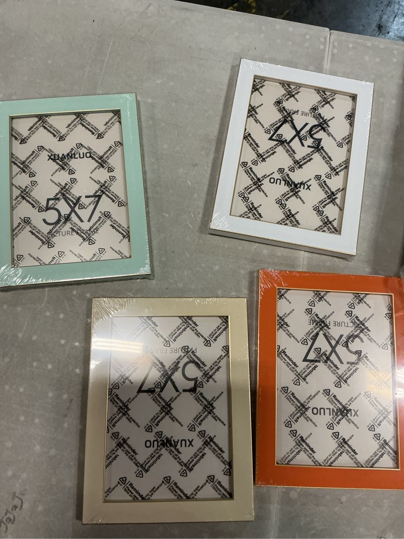 Condition photo showing New/Like New for xuanluo 5x7 picture frames set of 4, colorful photo frames with hd plastic cover, modern picture frames for wall or tabletop display- home & office decor(orange,light blue,light yellow,white)
