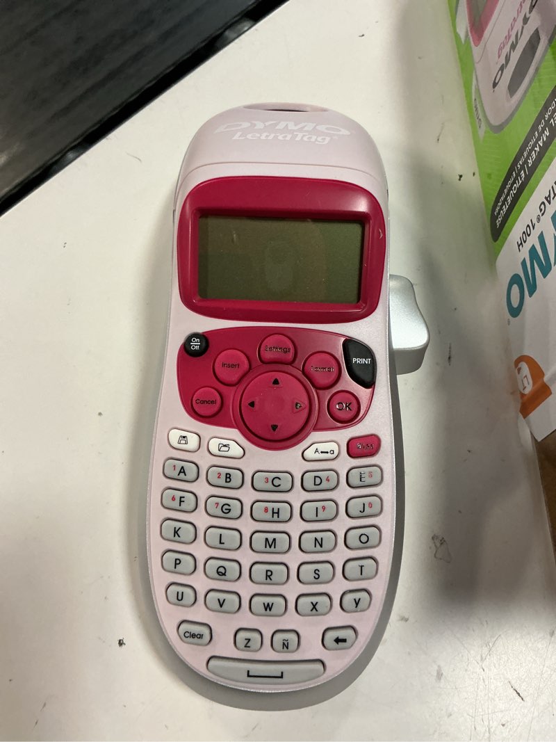 Condition photo showing New/Like New for dymo letratag lt-100h handheld aesthetic label maker, abc keyboard label printer with easy-to-use, 13 character lcd screen, great for home & office organization, pink pink machine + 1 tape