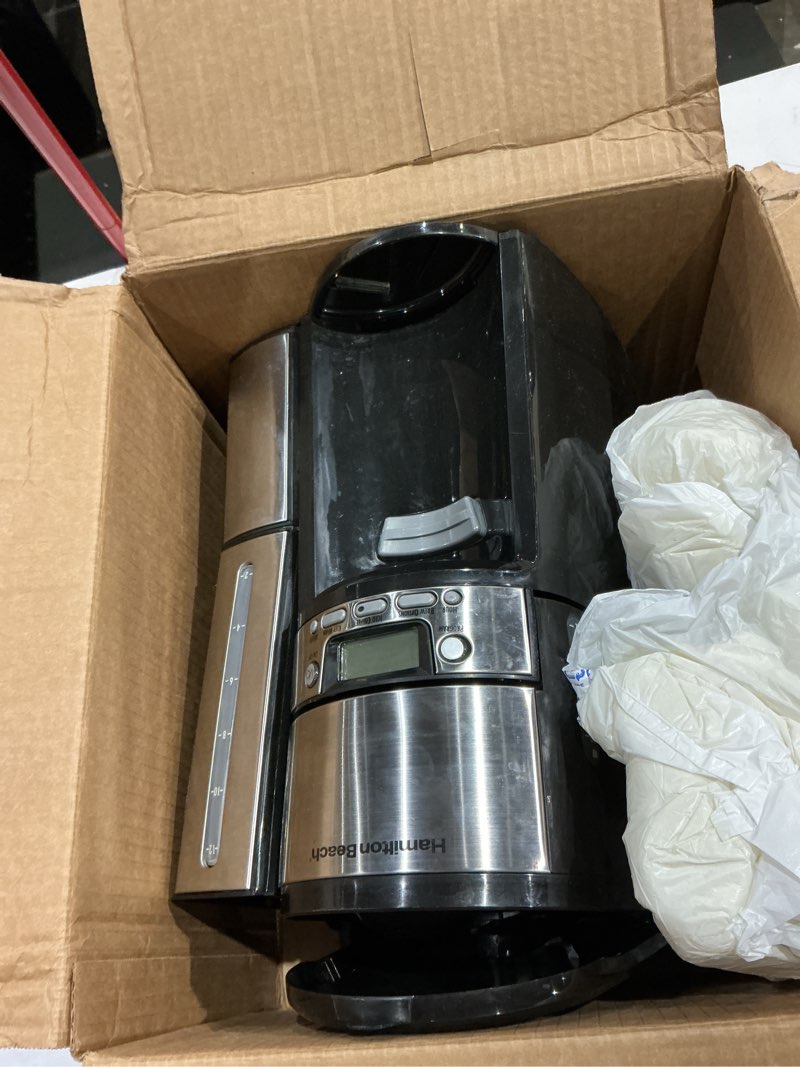 Condition photo showing As Is for hamilton beach one press programmable dispensing 12 cup coffee maker with internal coffee pot, stays warm and fresh for hours, 60 oz. removable reservoir, black & stainless steel (47950) black and silver