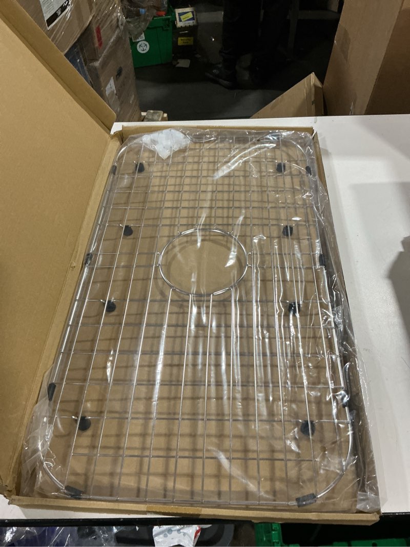 Condition photo showing Good Condition for serene valley sink protector grid 26-1/16" x 14-1/16", centered drain with corner radius 3-1/2", 304 stainless steel material nlw2614c