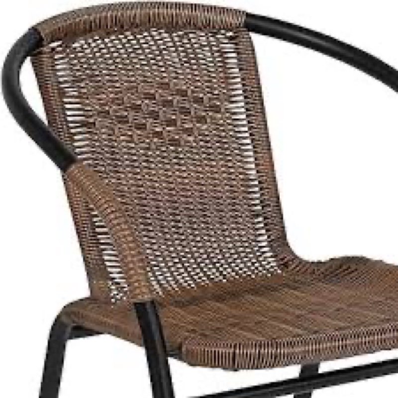 Lila modern rattan indoor/ outdoor chair (wobbles)