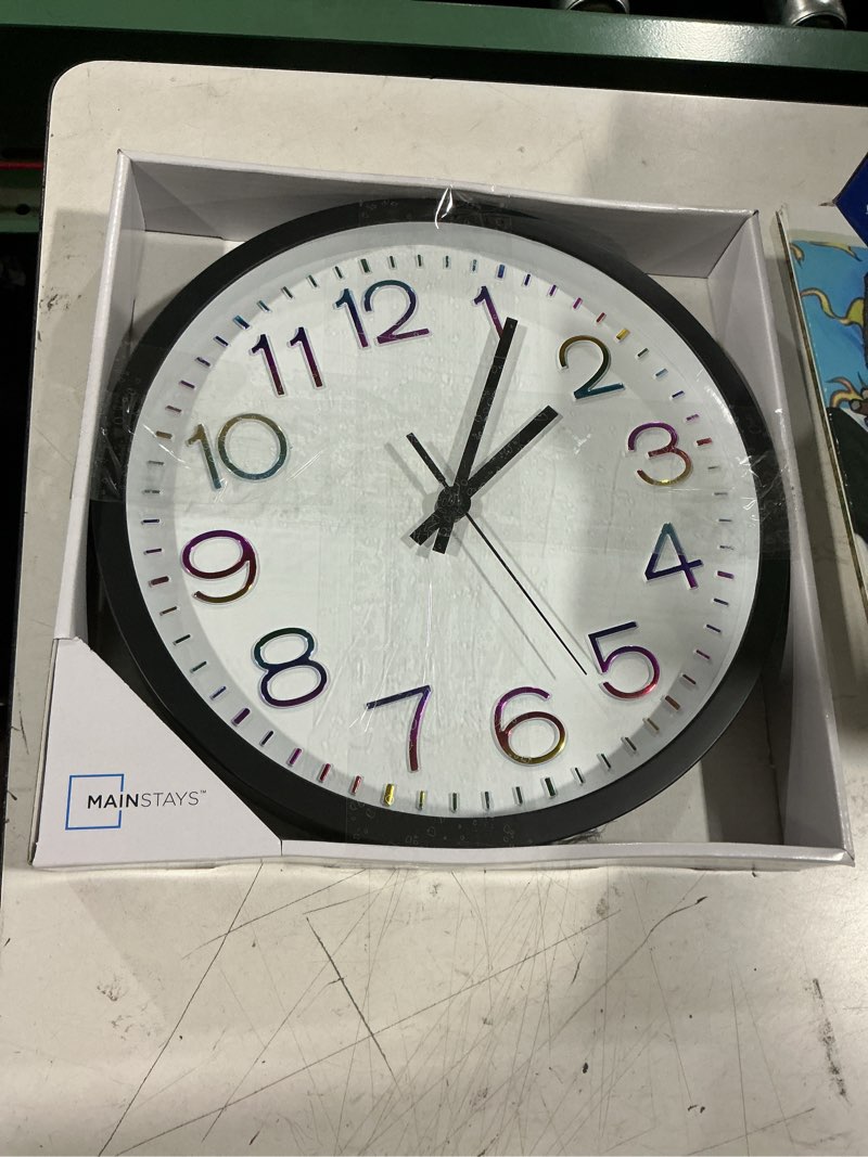 Condition photo showing Good Condition for mainstays 12" modern wall clock, multicolor numbers