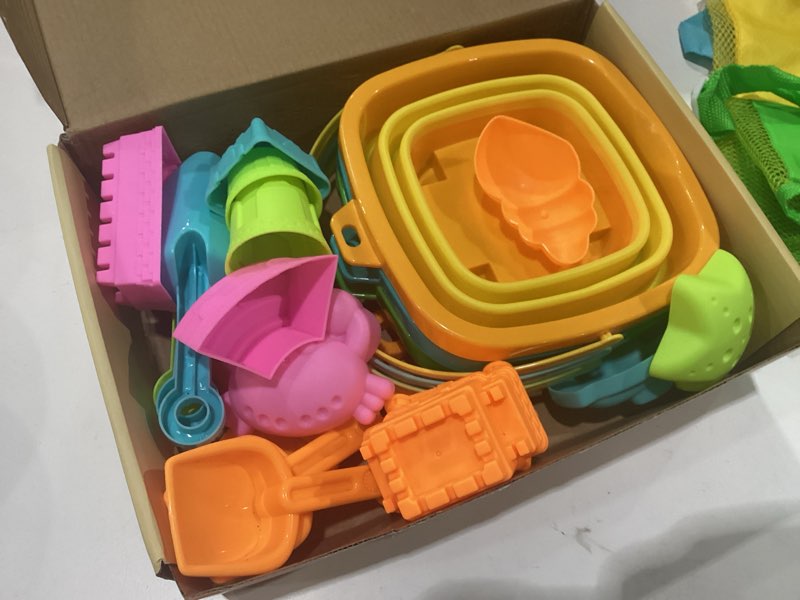 Condition photo showing Good Condition for dreamon beach toys for kids 3-10, collapsible sand toys include 3 pack foldable buckets with mesh bag, 24 pcs beach mold and shovels molds, travel sandbox beach toys for toddler 3*mesh bag