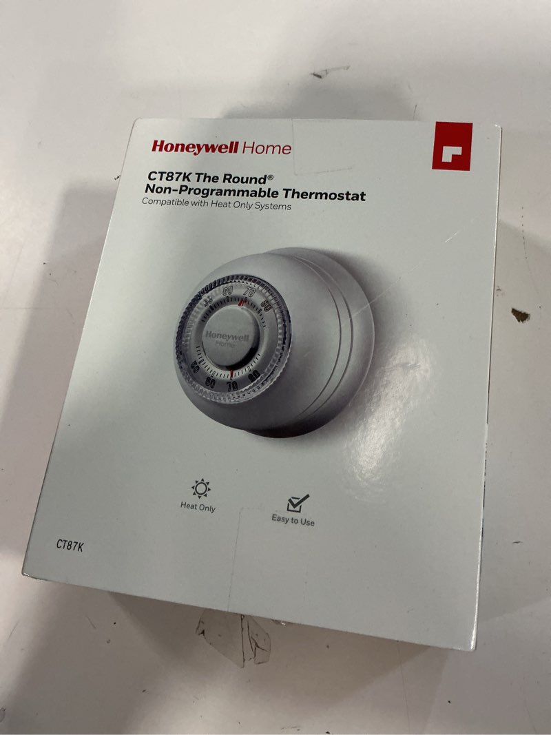 Condition photo showing New/Like New for Honeywell Home CT87K1004 The Round Heat Only Manual Thermostat,Large,White,Large Thermostat Round