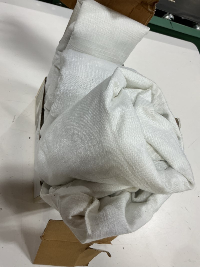 Condition photo showing As Is for allen + roth 63-in ivory blackout interlined back tab curtain panel pair