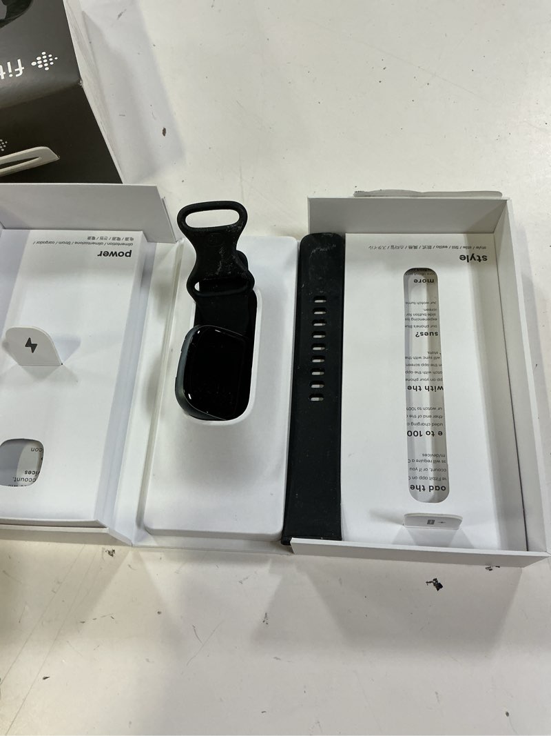 Condition photo showing As Is for fitbit versa 4 fitness smartwatch with daily readiness, gps, 24/7 heart rate, 40+ exercise modes, sleep tracking and more, black/graphite, one size (s & l bands included)