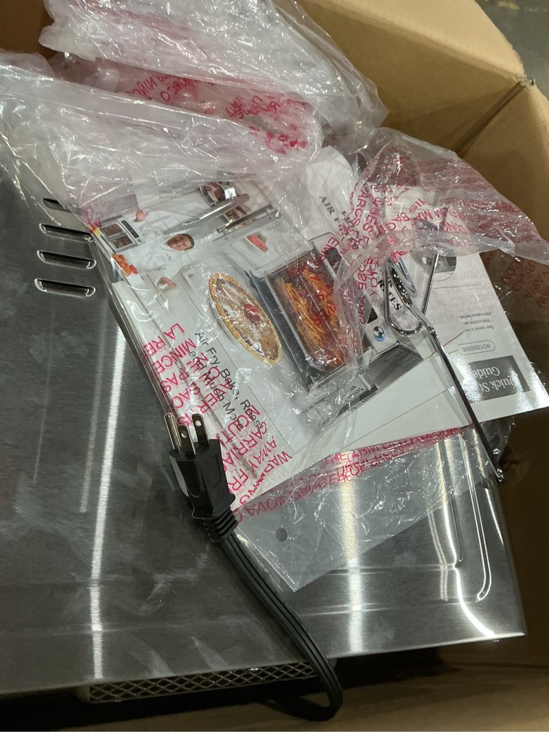 Condition photo showing As Is for dan - emeril lagasse extra large french door air fryer toaster oven combo, 24 cooking functions and digital controls, 7 accessories included, stainless steel finish, 26qt capacity