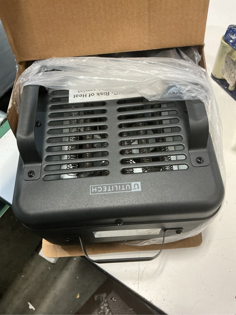 Condition photo showing As Is for utilitech ceramic space heater up to 1500w, 200 sq. ft