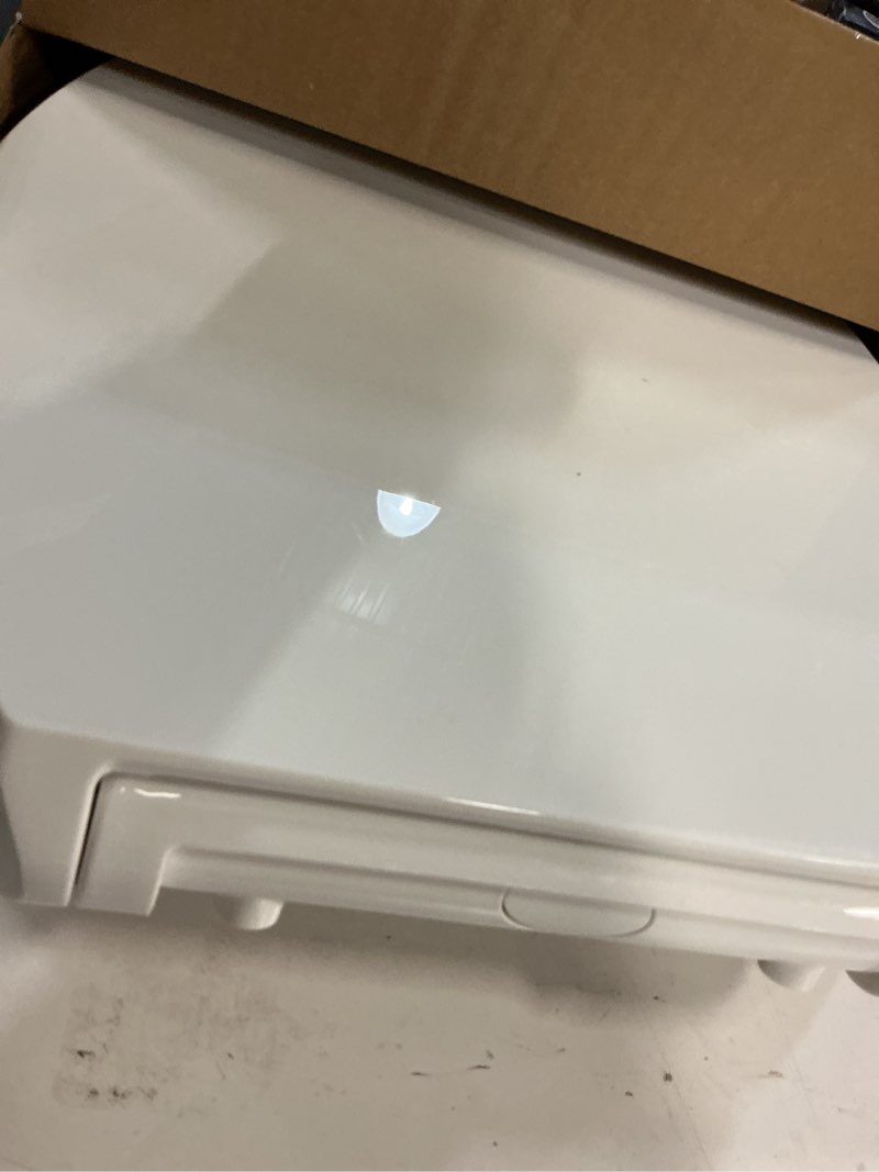 Condition photo showing As Is for kohler 25875-0 hyten 3" height, elevated soft close elongated toilet seat, contoured seat with grip-tight bumpers, quick-attach hardware, no slam toilet seat, white white elongated