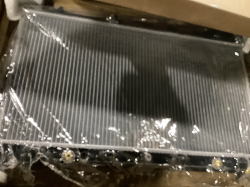Condition photo showing As Is for spectra premium cu2370 radiator with toc and eoc - 34-1/16" core compatible with chevrolet silverado, gmc and cadillac