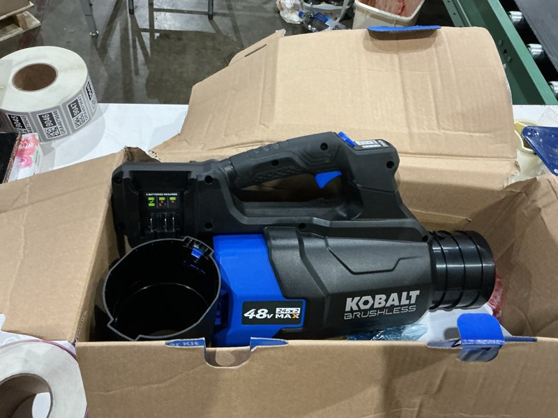 Condition photo showing As Is for kobalt 48v max (24vx2) 600 cfm / 150 mph handheld leaf blower kit, (2) 4.0ah batteries and charger included
