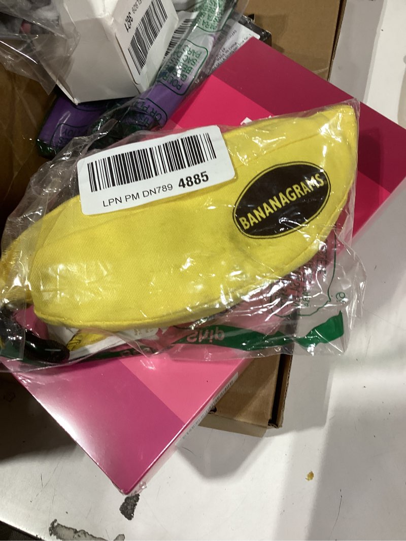 Condition photo showing New/Like New for bananagrams classic word game – fast-paced spelling & anagram, family & travel game , 144 letter tiles in portable banana pouch, 1–8 players, educational wordplay fun for ages 7+