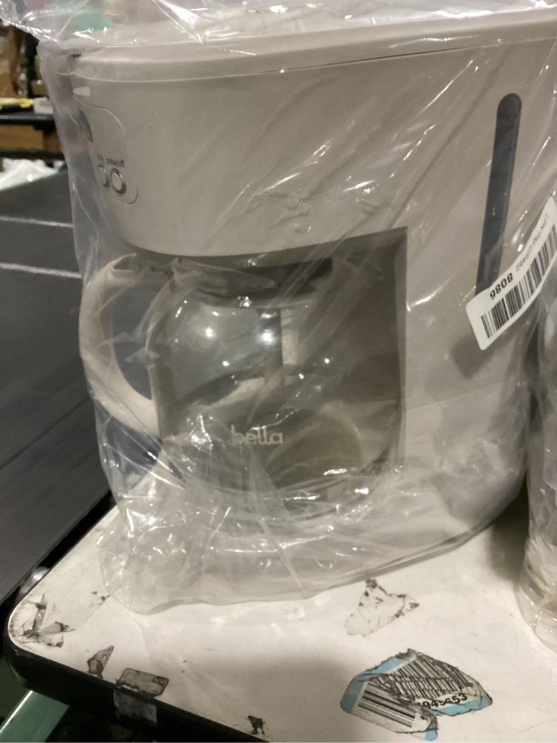 Condition photo showing As Is for bella 12 cup programmable coffee marker, reusable dishwasher safe accessories, easy lcd diaply, auto shutoff, 900 watt, oatmilk