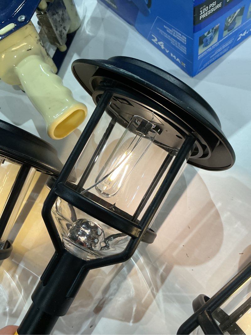 Condition photo showing As Is for sterno home gl29408bk4 solar led path light kit, 10 lumens, black, 4-pack