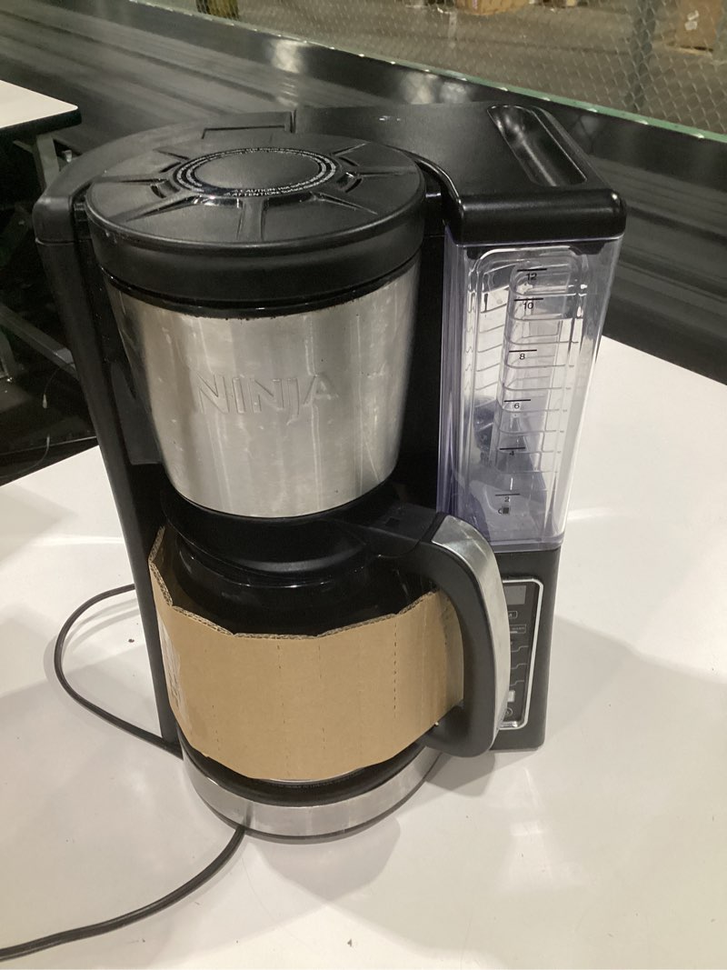 Condition photo showing As Is for (used, not tested)ninja 12-cup programmable coffee brewer, 2 brew styles, adjustable warm plate, 60oz water reservoir, delay brew - black/stainless steel