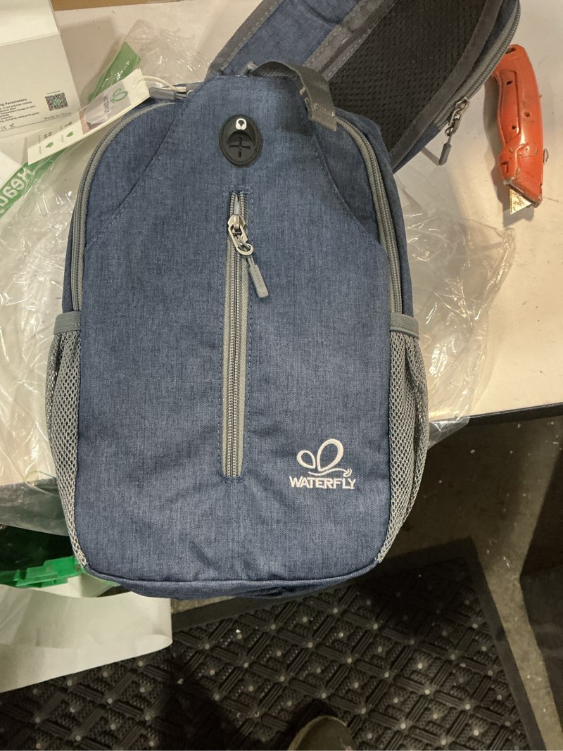 Condition photo showing New/Like New for waterfly crossbody sling backpack sling bag travel hiking chest bag daypack navy blue small
